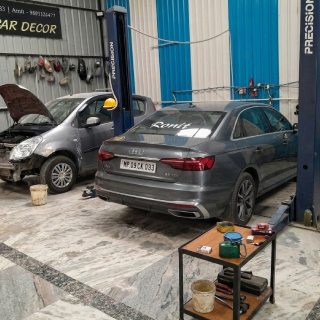 Mechanics working at RJ Motors garage
